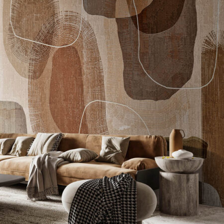 Toronto wallpaper installation featuring the Primordial Forms mural in a warm, modern living room with suede seating and layered neutral textures.