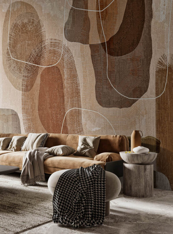 Toronto wallpaper installation featuring the Primordial Forms mural in a warm, modern living room with suede seating and layered neutral textures.
