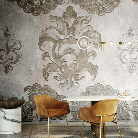 Faded Grace vintage lace wallpaper mural installed in a modern dining room with caramel chairs, marble furniture, and brass accents.